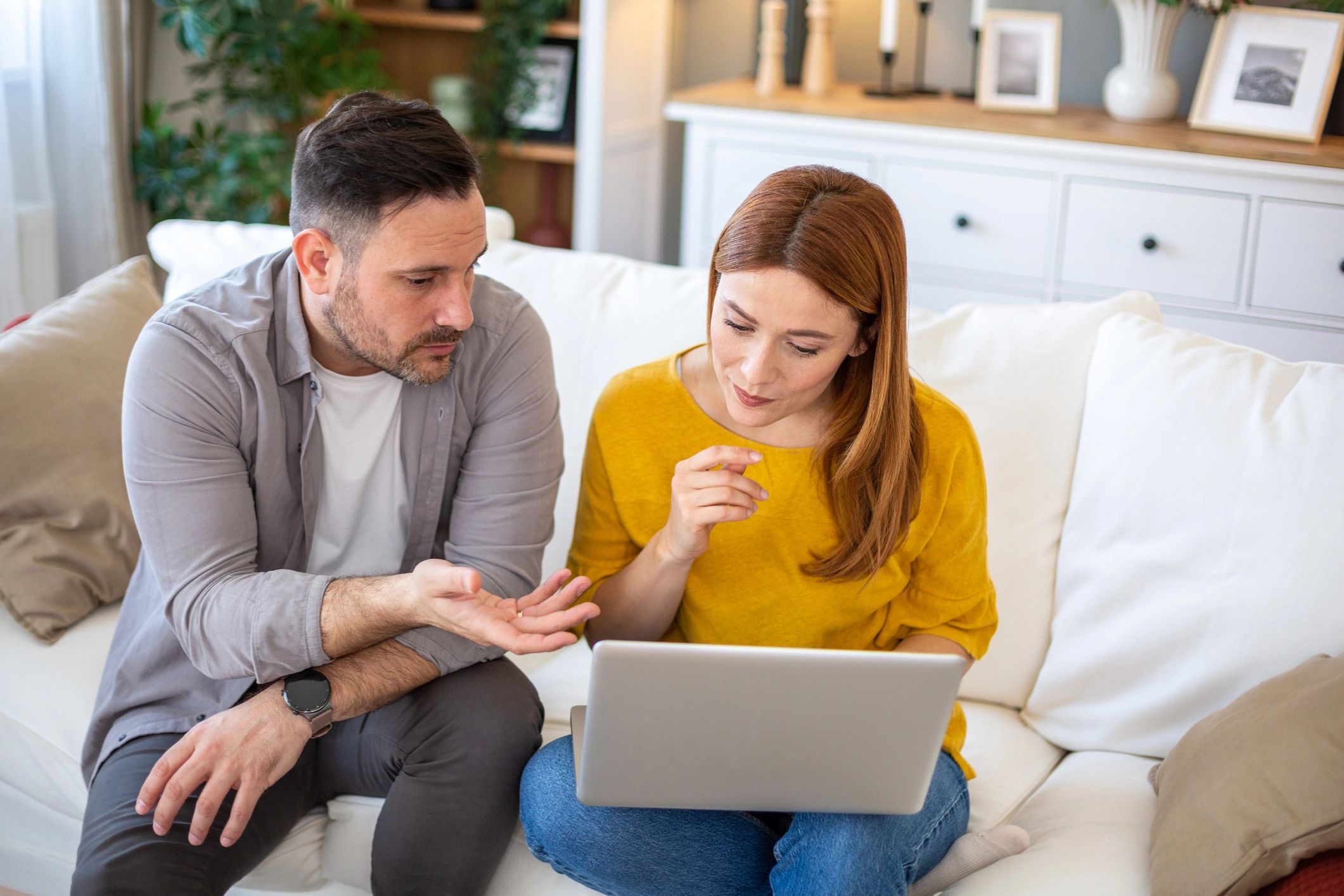 Homeowners discussing options at home